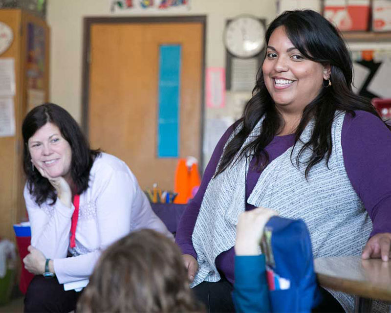 two women teaching in a young children's classroom